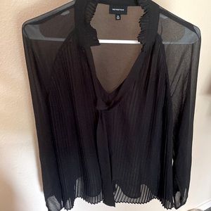 Sheer black blouse with pleated front and ruffled collar and loose tie